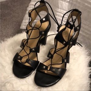 Black lace up criss-cross block heel with studs.